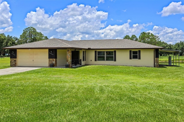 14325 Manchester Ave, Groveland, FL 34736 - ranch-style house with an attached garage, a front yard, concrete driveway, stone siding, and stucco siding