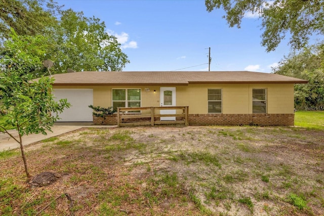 302 W Rose Ln, Lady Lake, FL 32159 - ranch-style house with an attached garage and driveway