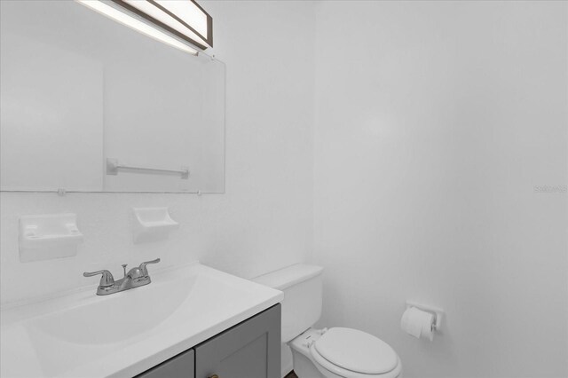 302 W Rose Ln, Lady Lake, FL 32159 - bathroom with toilet and vanity