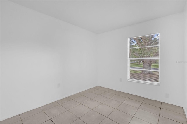 302 W Rose Ln, Lady Lake, FL 32159 - empty room with light tile patterned flooring