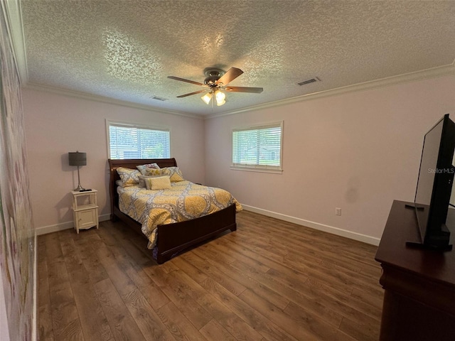 219 Magnolia Cir, Eustis, FL 32726 - bedroom featuring multiple windows, dark wood-type flooring, ornamental molding, a textured ceiling, and a ceiling fan