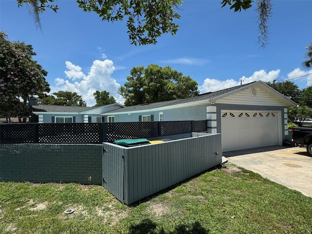 219 Magnolia Cir, Eustis, FL 32726 - view of front of property with concrete driveway and a garage
