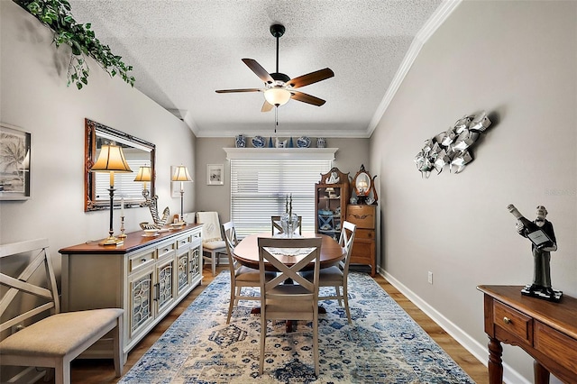 1309 Corona Ave, The Villages, FL 32159 - dining space with a textured ceiling, a ceiling fan, ornamental molding, and wood finished floors
