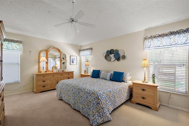 1309 Corona Ave, The Villages, FL 32159 - bedroom with light colored carpet, a textured ceiling, and a ceiling fan