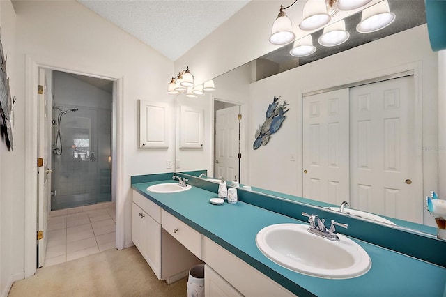 1309 Corona Ave, The Villages, FL 32159 - full bath featuring a shower stall, double vanity, tile patterned flooring, vaulted ceiling, and a textured ceiling