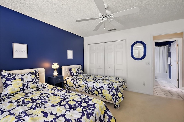 1309 Corona Ave, The Villages, FL 32159 - bedroom featuring carpet flooring, a closet, a textured ceiling, and ceiling fan