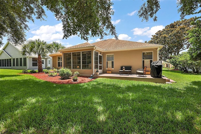 1309 Corona Ave, The Villages, FL 32159 - rear view of house featuring a yard, a patio, stucco siding, a shingled roof, and a sunroom
