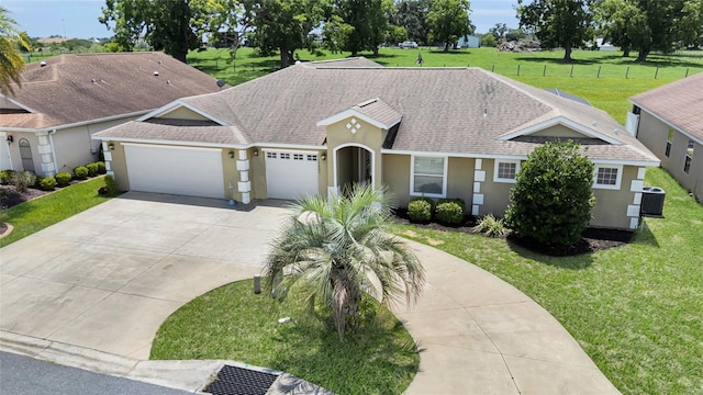 12407 NE 48th Loop, Oxford, FL 34484 - ranch-style home with concrete driveway, stucco siding, an attached garage, and a shingled roof