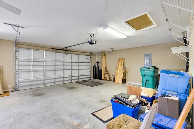 12407 NE 48th Loop, Oxford, FL 34484 - garage with electric panel and a garage door opener