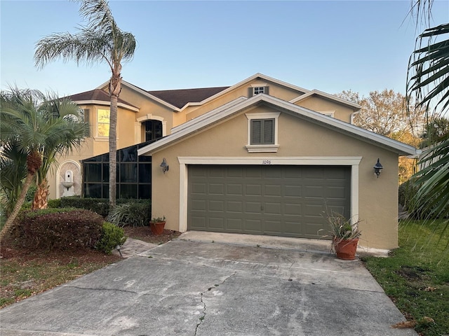 1096 Linkside Ct, Apopka, FL 32712 - view of front of house featuring stucco siding, concrete driveway, and an attached garage