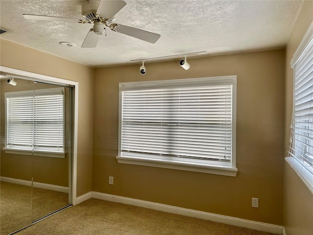 1096 Linkside Ct, Apopka, FL 32712 - carpeted spare room with a textured ceiling and a ceiling fan