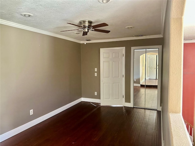 1096 Linkside Ct, Apopka, FL 32712 - empty room featuring dark wood finished floors, a ceiling fan, ornamental molding, and a textured ceiling