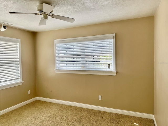 1096 Linkside Ct, Apopka, FL 32712 - unfurnished room with light carpet, a textured ceiling, and a ceiling fan