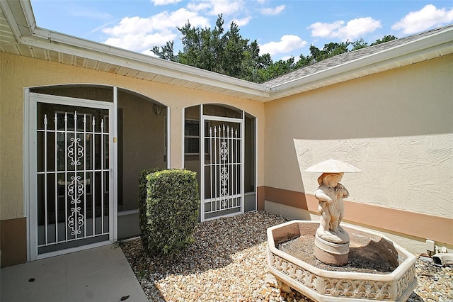 1512 Cervantes Pl, The Villages, FL 32159 - doorway to property with stucco siding