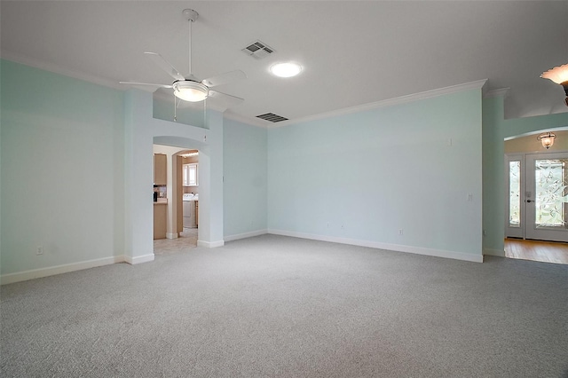1512 Cervantes Pl, The Villages, FL 32159 - spare room featuring arched walkways, crown molding, ceiling fan, light carpet, and washer / dryer