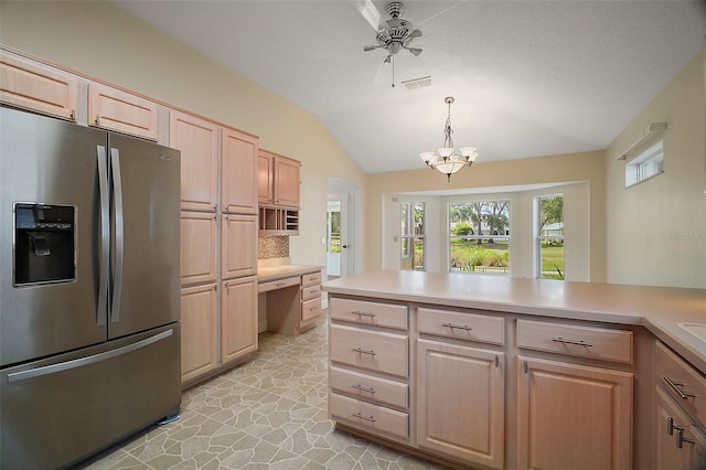 1512 Cervantes Pl, The Villages, FL 32159 - kitchen featuring stainless steel fridge, lofted ceiling, light brown cabinets, light countertops, and decorative backsplash
