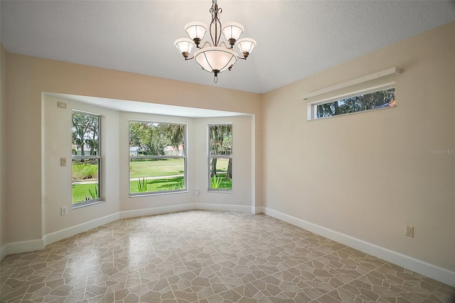 1512 Cervantes Pl, The Villages, FL 32159 - empty room with stone flooring and a chandelier