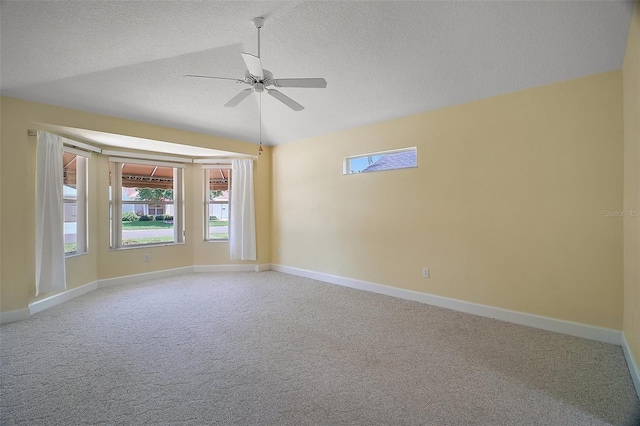 1512 Cervantes Pl, The Villages, FL 32159 - spare room featuring light colored carpet, ceiling fan, healthy amount of natural light, a textured ceiling, and lofted ceiling