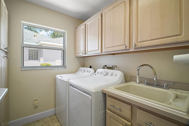 1512 Cervantes Pl, The Villages, FL 32159 - laundry room with washing machine and dryer, cabinet space, and a textured ceiling