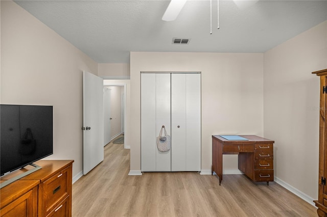 17970 SE 102nd Ct, Summerfield, FL 34491 - bedroom with light wood-style floors, a closet, and ceiling fan