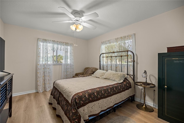 17970 SE 102nd Ct, Summerfield, FL 34491 - bedroom with wood finished floors and ceiling fan