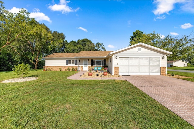 17970 SE 102nd Ct, Summerfield, FL 34491 - single story home with a garage, decorative driveway, brick siding, a front yard, and covered porch