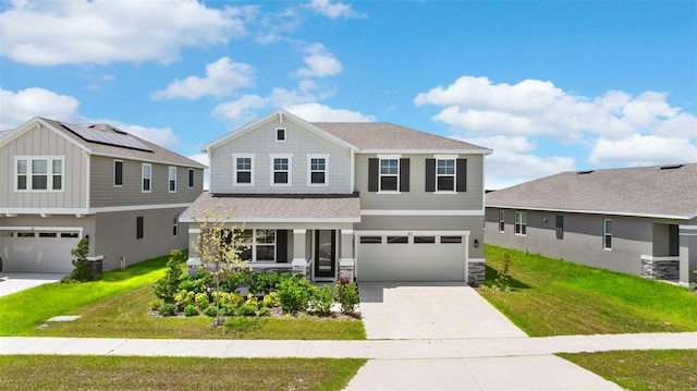 872 Griffon Ave, Lake Alfred, FL 33850 - view of front of house with an attached garage, driveway, stone siding, a front yard, and covered porch