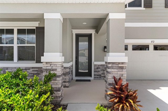 872 Griffon Ave, Lake Alfred, FL 33850 - property entrance featuring stone siding and stucco siding