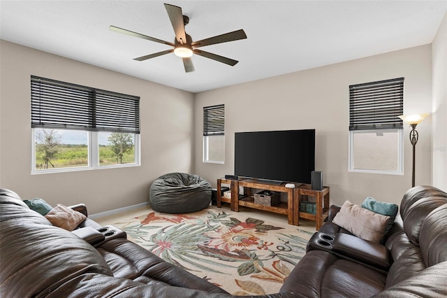 872 Griffon Ave, Lake Alfred, FL 33850 - carpeted living room featuring ceiling fan and baseboards