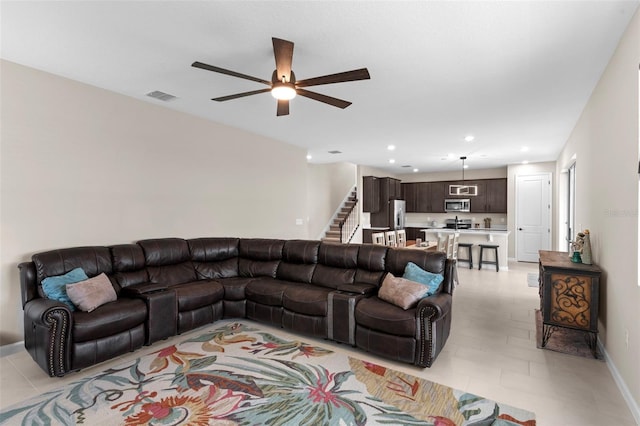 872 Griffon Ave, Lake Alfred, FL 33850 - living room featuring a ceiling fan, stairs, and recessed lighting