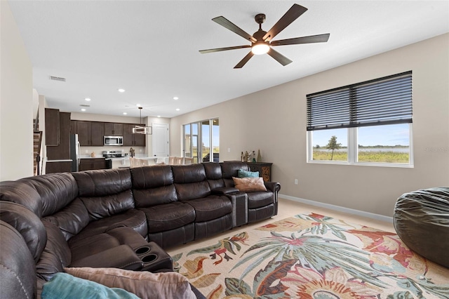 872 Griffon Ave, Lake Alfred, FL 33850 - living room featuring a ceiling fan, light carpet, and recessed lighting