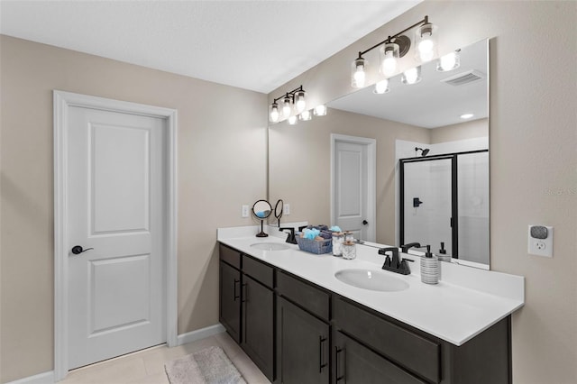 872 Griffon Ave, Lake Alfred, FL 33850 - bathroom featuring double vanity, a shower stall, and tile patterned floors