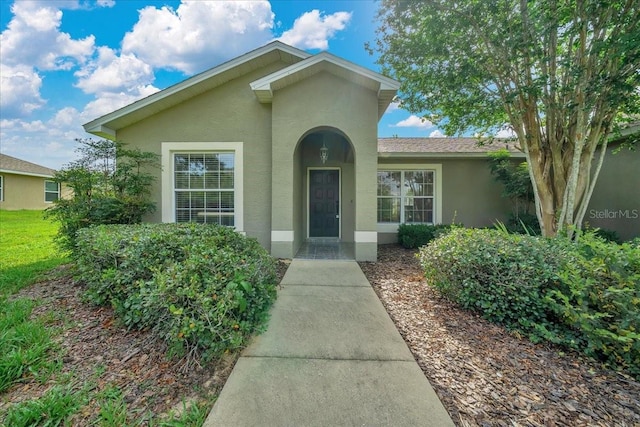 10331 SW 45th Ave, Ocala, FL 34476 - doorway to property featuring stucco siding