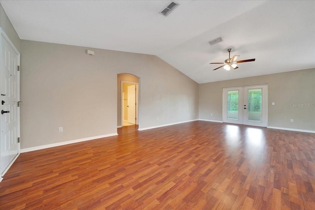 10331 SW 45th Ave, Ocala, FL 34476 - spare room with ceiling fan, wood finished floors, arched walkways, french doors, and vaulted ceiling