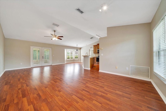 10331 SW 45th Ave, Ocala, FL 34476 - unfurnished living room with vaulted ceiling, dark wood finished floors, and a ceiling fan