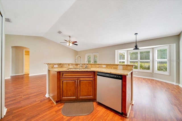 10331 SW 45th Ave, Ocala, FL 34476 - kitchen featuring dishwasher, arched walkways, light wood-style floors, and vaulted ceiling