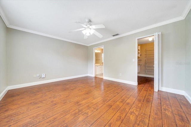 10331 SW 45th Ave, Ocala, FL 34476 - unfurnished room featuring a ceiling fan, hardwood / wood-style flooring, and ornamental molding
