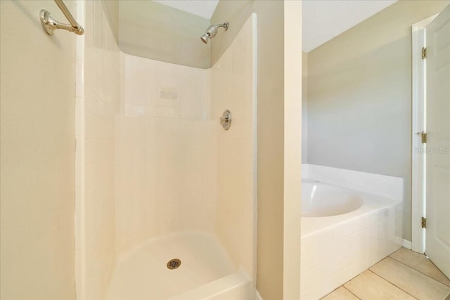 10331 SW 45th Ave, Ocala, FL 34476 - bathroom featuring tile patterned flooring, a bath, and a shower