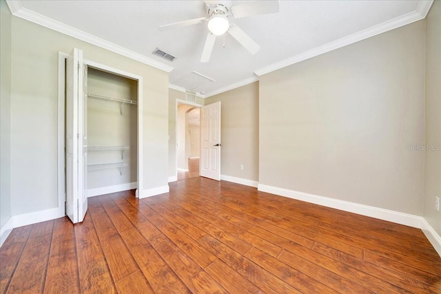 10331 SW 45th Ave, Ocala, FL 34476 - unfurnished bedroom featuring a closet, ornamental molding, hardwood / wood-style floors, and ceiling fan