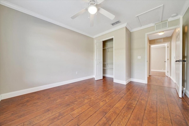 10331 SW 45th Ave, Ocala, FL 34476 - unfurnished bedroom featuring a closet, hardwood / wood-style flooring, attic access, crown molding, and ceiling fan