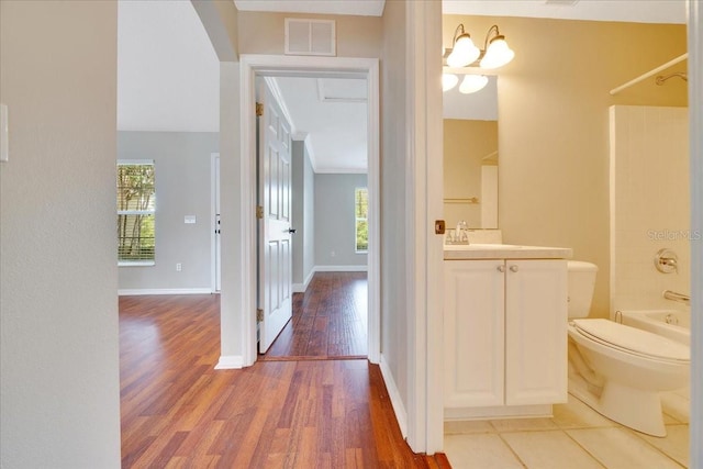 10331 SW 45th Ave, Ocala, FL 34476 - full bathroom with vanity, plenty of natural light, wood finished floors, and shower / bathtub combination