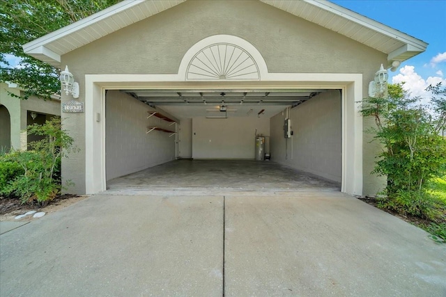 10331 SW 45th Ave, Ocala, FL 34476 - garage with concrete driveway and strapped water heater