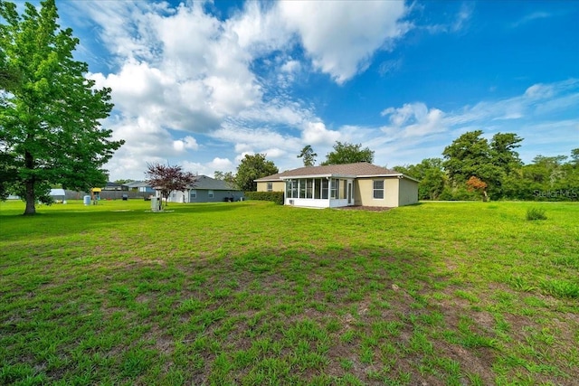 10331 SW 45th Ave, Ocala, FL 34476 - view of grassy yard featuring a sunroom