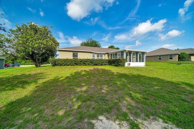 10331 SW 45th Ave, Ocala, FL 34476 - rear view of property featuring a sunroom and a yard