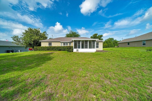 10331 SW 45th Ave, Ocala, FL 34476 - back of property featuring a sunroom and a lawn