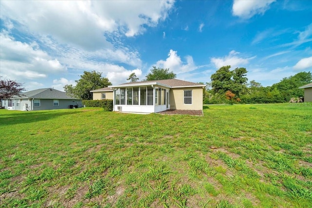 10331 SW 45th Ave, Ocala, FL 34476 - back of house featuring a sunroom and a lawn