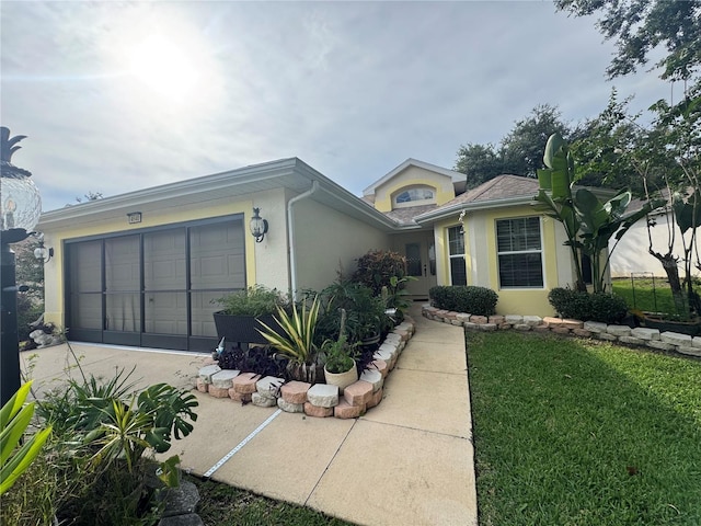 4640 Glen Coe St, Leesburg, FL 34748 - single story home featuring stucco siding, concrete driveway, a garage, and a front lawn