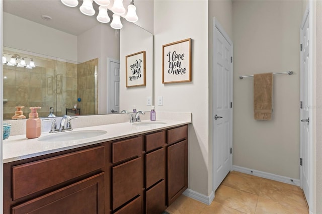 3467 Buoy Cir, Winter Garden, FL 34787 - bathroom with double vanity, a stall shower, tile patterned floors, and a chandelier