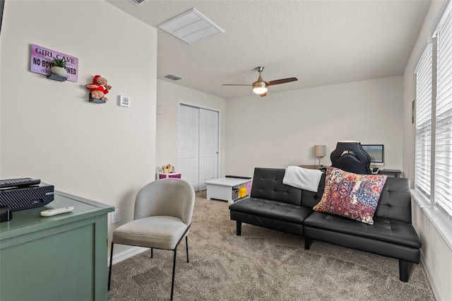 3467 Buoy Cir, Winter Garden, FL 34787 - living room featuring light carpet, a ceiling fan, plenty of natural light, and a textured ceiling