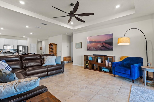 3467 Buoy Cir, Winter Garden, FL 34787 - living area featuring a ceiling fan, light tile patterned floors, recessed lighting, and a raised ceiling